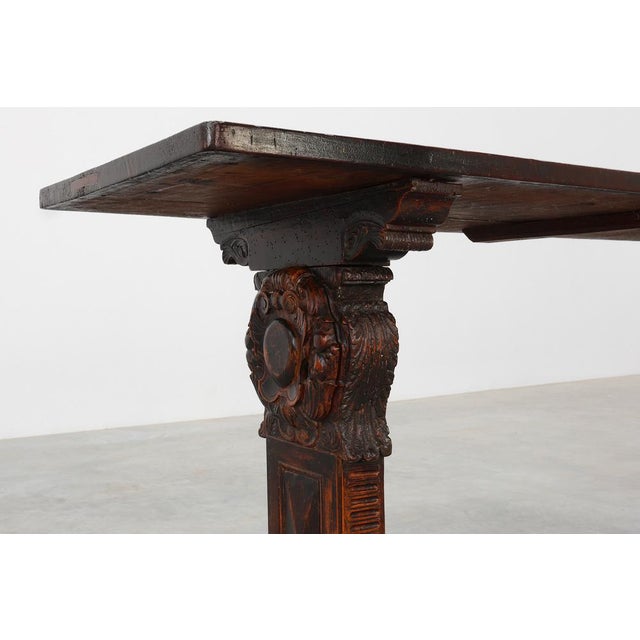 A rare and sculptural Renaissance console table from 16th‑century Tuscany, carved in richly patinated wood and displaying...