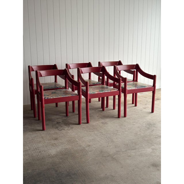 Set of six vintage sculptural dining chairs in a deep red lacquered finish. Rounded cylindrical legs with softly curved...