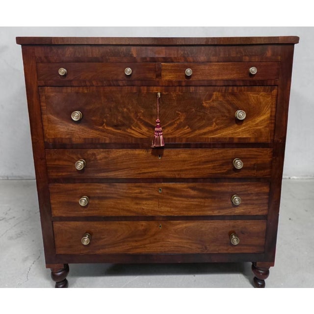 An exceptional American Classical chest of drawers, handcrafted in the United States circa 1845 and showcasing some of the...