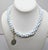 Metal Vintage Signed Hattie Carnegie 3-Strand White Beaded Faux-Turquoise Necklace For Sale - Image 7 of 8