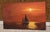 Beautiful sunset with sailboat.