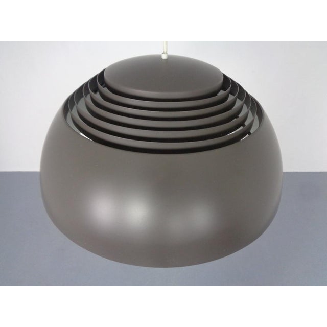 Couple gray AJ ceiling lamps, designed by Arne Jacobsen for Louis Poulsen. This piece has an attribution mark, I am sure...