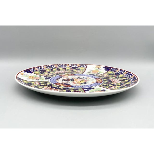 Stunning floral Imari charger with incredible applied details. Lovely blue, pink, green and gold designs over white...