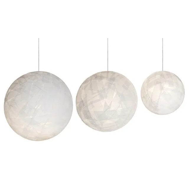 Orbs of light fill the void. Made in Italy from paper strips randomly attached to an acrylic substructure, these lights...