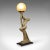This is a vintage figural table lamp. An English, metallic plaster desk light in Art Deco taste by Leonardine, dating to...