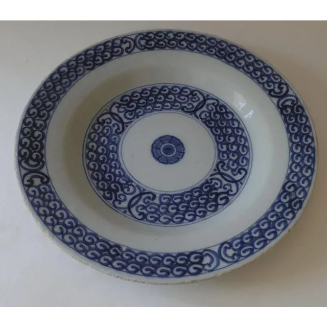 Delft blue and white tin glazed plate. Measures 9" diameter. Early 19th century.