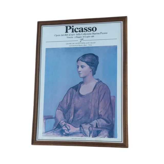 A framed vintage promotional poster for a Pablo Picasso exhibition featuring works from the Marina Picasso collection. The...