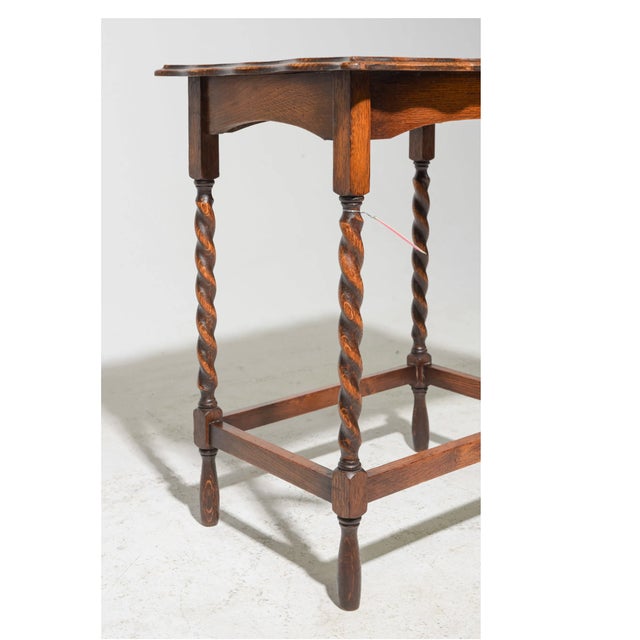 Classic English oak, but with a little more personality. This Antique British side table is crafted in warm oak and...
