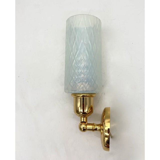 Single wall lamp attributed to the cenedese company from around the 1970s. the glass is hand-moulded. the color of the...