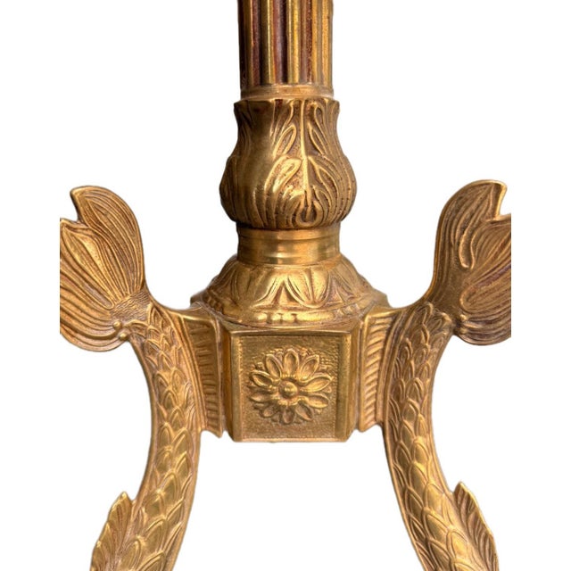 This impressive side table, crafted from antique brass, combines the style of the Hollywood Regency era with a koi motif...