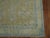 An intermediate size Chinese Peking rug in soft blue and champagne tones from the early 20th century 5'3'' x 8'1''