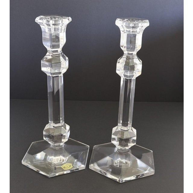 A sophisticated pair of Val Saint Lambert crystal candlesticks from Belgium, showcasing the maker’s renowned clarity and...