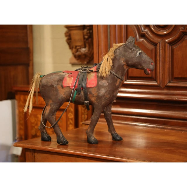 Interesting antique horse sculpture from France; crafted, circa 1870, the sculpture features a hand-painted horse made of...
