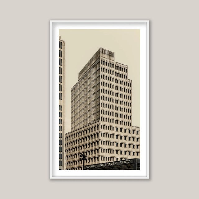 Potsdamer Platz, Berlin, Germany. A yellow-toned black and white minimal architectural photograph captures a boxlike...