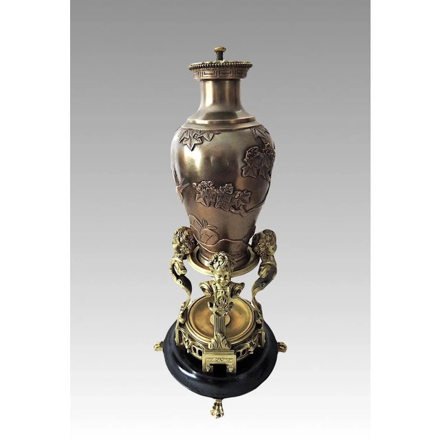 An absolutely stunning piece by Messenger Phipson, England - a side table with a incised gilt decorated round glass top....