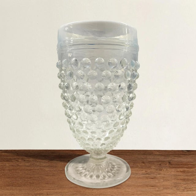 A playful set of six vintage American hobnail juice glasses with opaque white rims fading to a clear glass at the bottom....