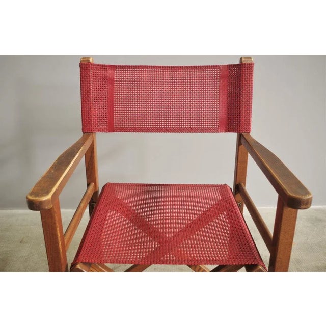 Folding director's chair in ash wood with seat and back in Bordeaux pvc fabric, 90s.
