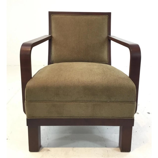 Stylish mid-century modern style olive green Chennile lounge chair, warm mahogany finished wood frame, showroom floor sample