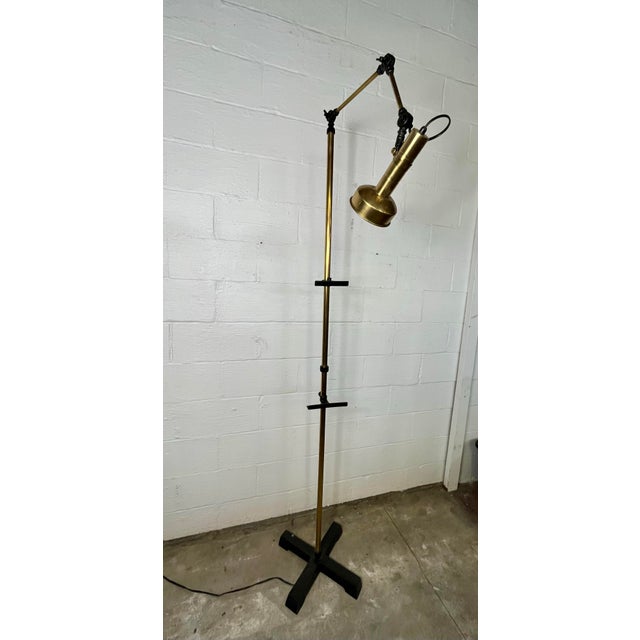 A nice elegant and architectural design. Made of brass and nicely contrasting black iron. Patina consistent with age. No...