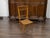 An English Turn of the Century bamboo slipper chair from the early 20th century, with cane seat. Created in England during...