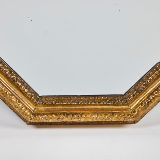 Hand-carved and gilded, circa 1850 Italian frame with new mirror.