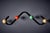Coat hanger by Roger Feraud for GEO, featuring a black lacquered iron frame with four multicoloured wooden ball hooks, its...