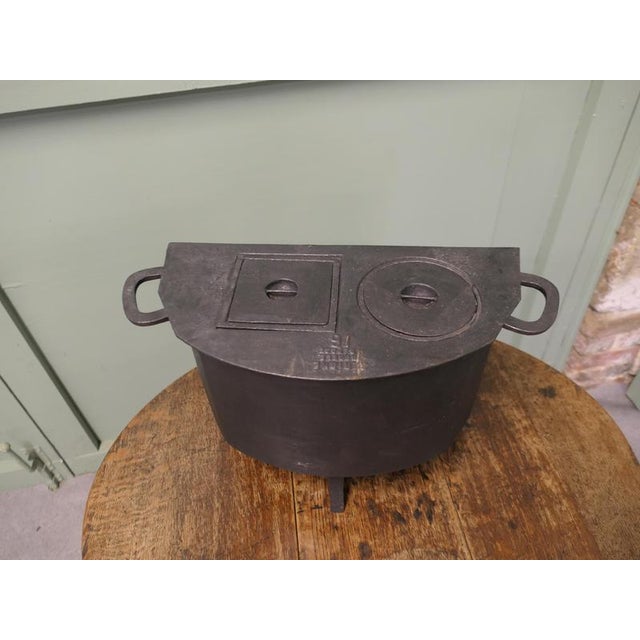 Small Size Cast Iron Romany Cooker An interesting piece from 19th Century France, made by Serigne it seems to be unused,...