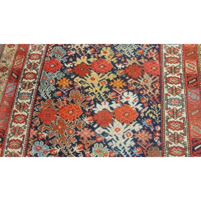 This exceptional Antique Persian Bakhtiari runner, woven around 1910, is a magnificent example of the bold artistry and...