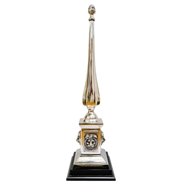 A monumental Neoclassical-style obelisk standing at an impressive 27.5 inches tall. The sleek, tapering spire is topped...