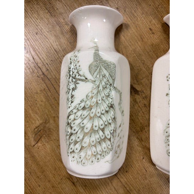 A graceful pair of vintage English wall pocket vases by Kingston Pottery, notable for their elegant, tapering shape and...