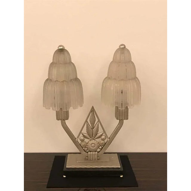 Grand French Art Deco table lamp created and signed by Marius Ernest Sabino, (1878-1961). The shades are clear frosted...