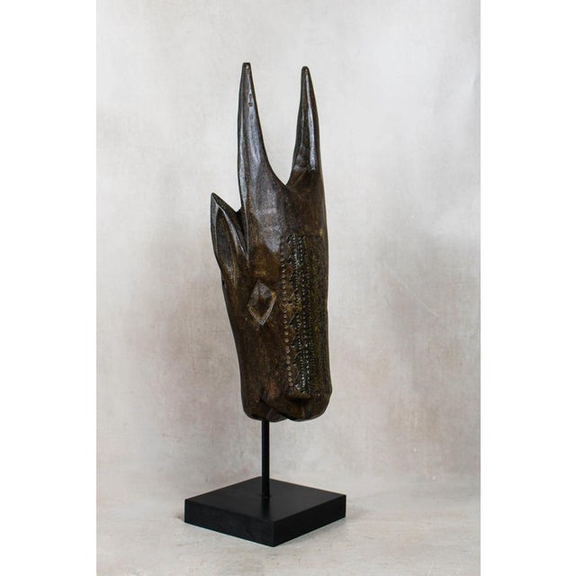 Malian bull mask with repoussé metal work ​bring a bold, grounding energy to your interior with this exceptional bull mask...