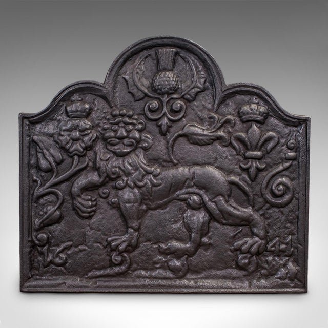 This is an antique relief fire back. An English, cast iron decorative fireplace reflector with Carolean taste, dating to...
