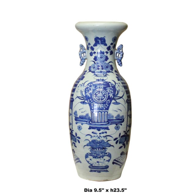 This is a Chinese porcelain tall vase in the distressed pale very light blue base color. Traditional Chinese flower and...