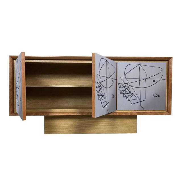"Artistica Dieci" sideboard, 2026, by Meccani Studio for Meccani Design. A beautiful oak sideboard with cherry and walnut...