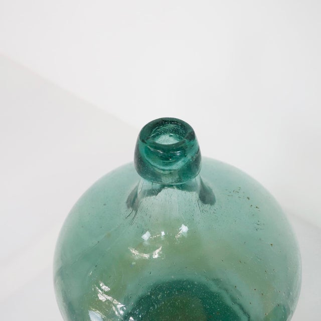 Circa 1940, we offer this pair of handmade water bottles.