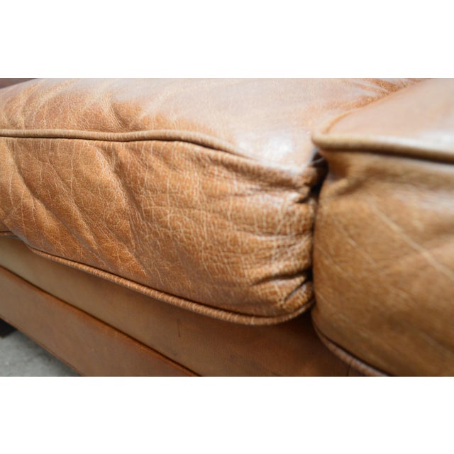 Standard rt Sofa by Ralph Lauren. Store item #535. It features leather upholstery and comes with pillows.