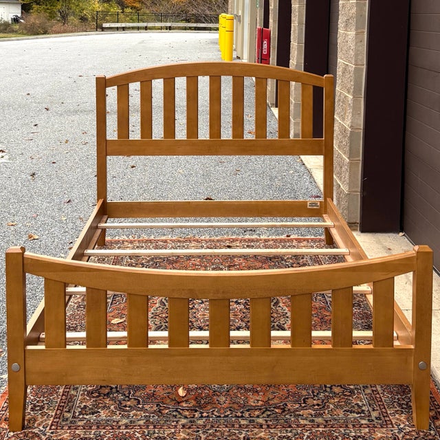 A vintage Ethan Allen Elements collection Arts & Crafts style solid maple full bed frame having arched slat headboard and...