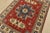 A traditional tribal Caucasian Kazak rug hand-knotted with an all-wool pile on a cotton foundation. This oriental rug...