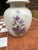 Up for consideration is a beautiful white ceramic jar with a matching lid and floral details. This would look lovely in...