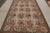 Hand-knotted in wool, this 6x9 European needlepoint rug originating from China, features floral designs that speak to...
