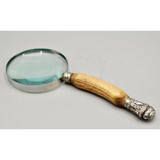 A fine quality antique English natural stag horn handled magnifying glass with sterling silver mounts, likely Sheffield....
