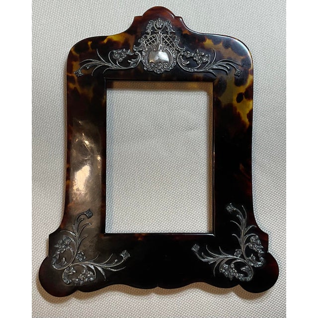 timeless elegance of the Victorian era with this captivating antique picture frame. Crafted from rich, luminous faux...