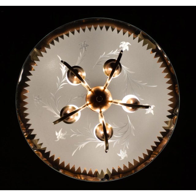 Lovely Art Deco chandelier with scrolled brass terminating in five scallop edged flower form socket cups, supported by...