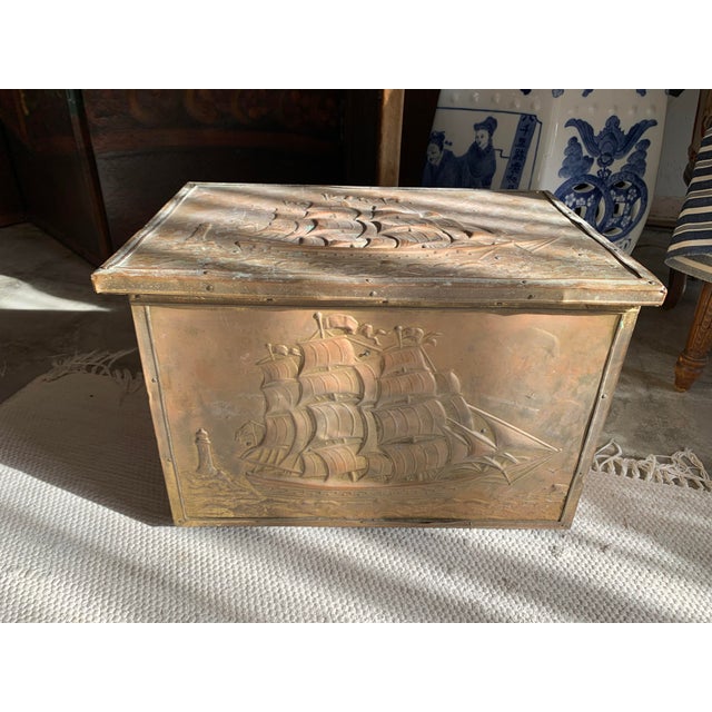 Here we have a lovely solid wood box with a hinged lid. All four sides and the lid are covered with embossed brass. Lots...