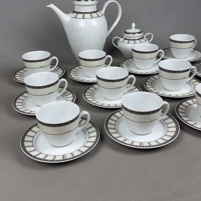 Refined and prestigious complete tea service for 12 in fine white porcelain, signed by the Parisian maison Pierre Cardin,...