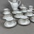 Refined and prestigious complete tea service for 12 in fine white porcelain, signed by the Parisian maison Pierre Cardin,...