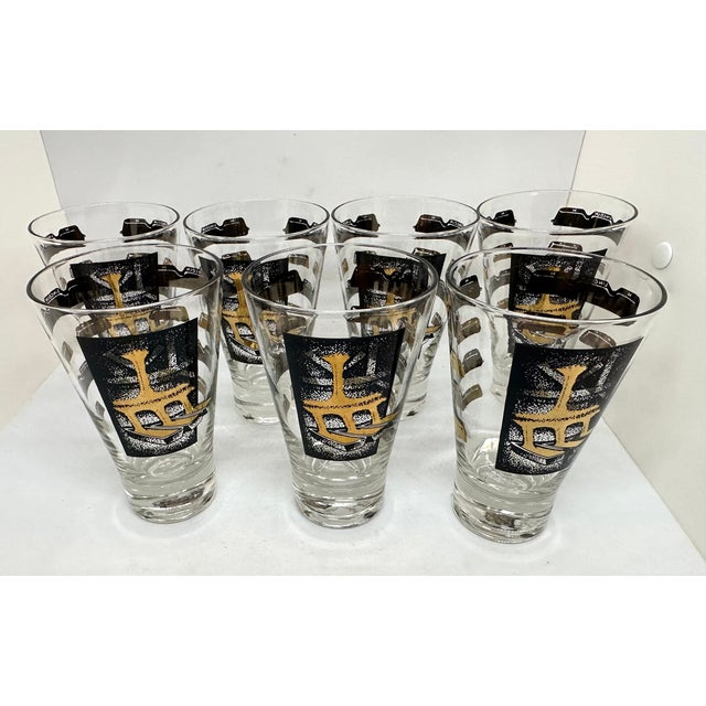 Cera Lincoln cocktail/champagne glasses set of 7 Mid-century24k gold and Black transparent glasses. Design on front shows...