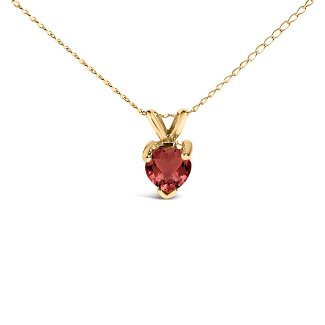 Evoke the essence of eternal elegance with this captivating pendant necklace, featuring a heart-shaped garnet, a symbol of...