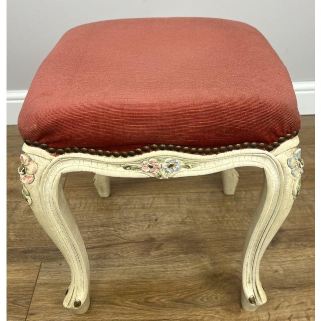 A beautifully styled Vintage French shabby chic footstool , featuring a softly curved silhouette and charming decorative...